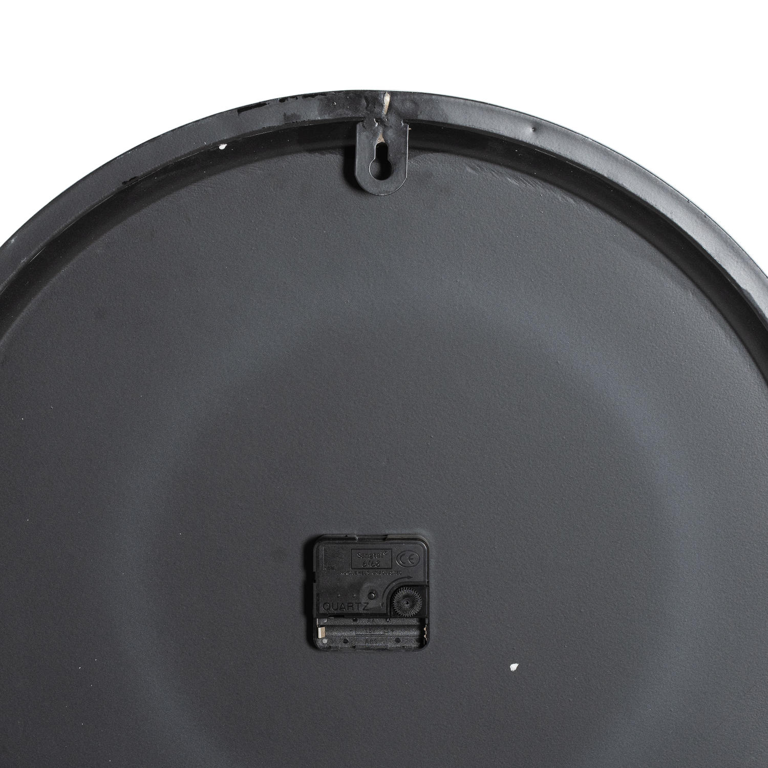 Sleek black wall clock back with quartz mechanism; minimalist design suited for modern interiors, showcasing refined craftsmanship.