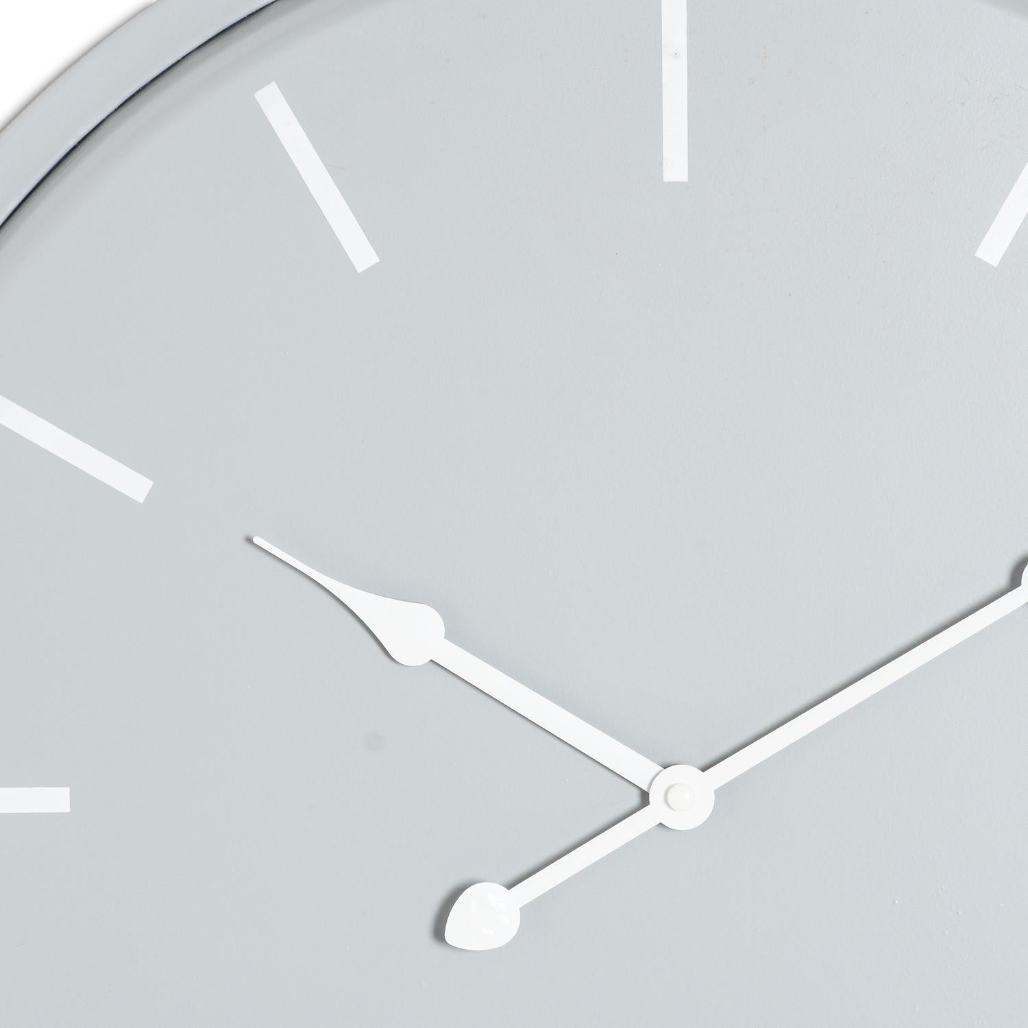 Sleek grey wall clock with white minimalist hour markers and hands, blending classic elegance with modern simplicity.