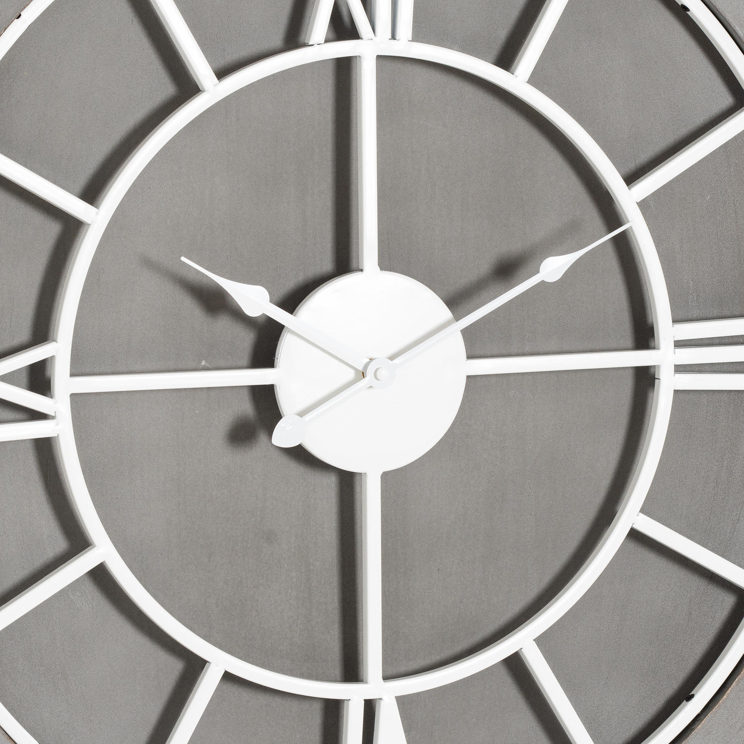 Sleek grey wall clock featuring white Roman numerals and elegant metal hands, perfect for timeless home decor.