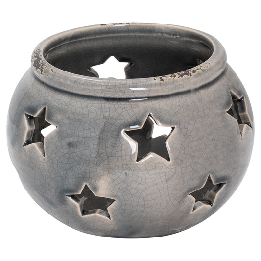 Artisanal ceramic lantern in a distressed grey finish, featuring cut-out star motifs for warm, intimate lighting.