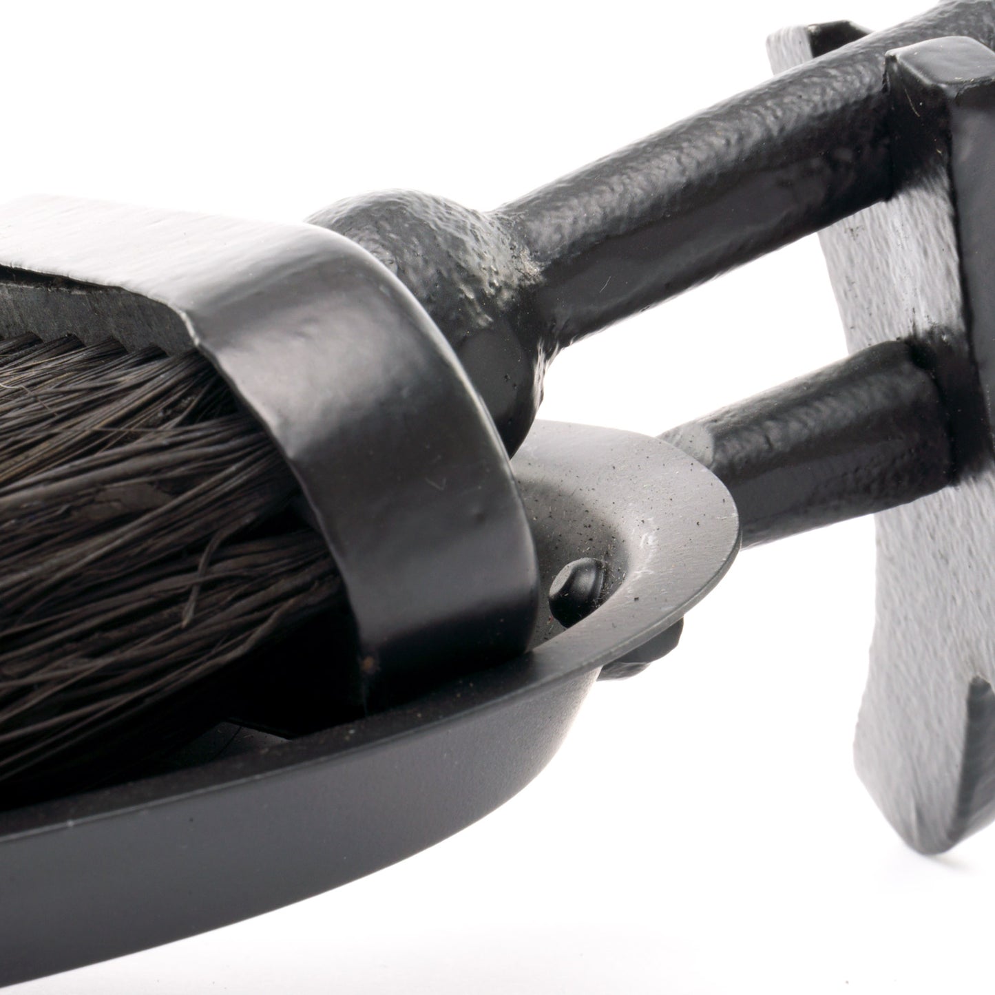 Black hearth tidy featuring a crook handle and sleek finish, combining elegance and functionality for any decor style.