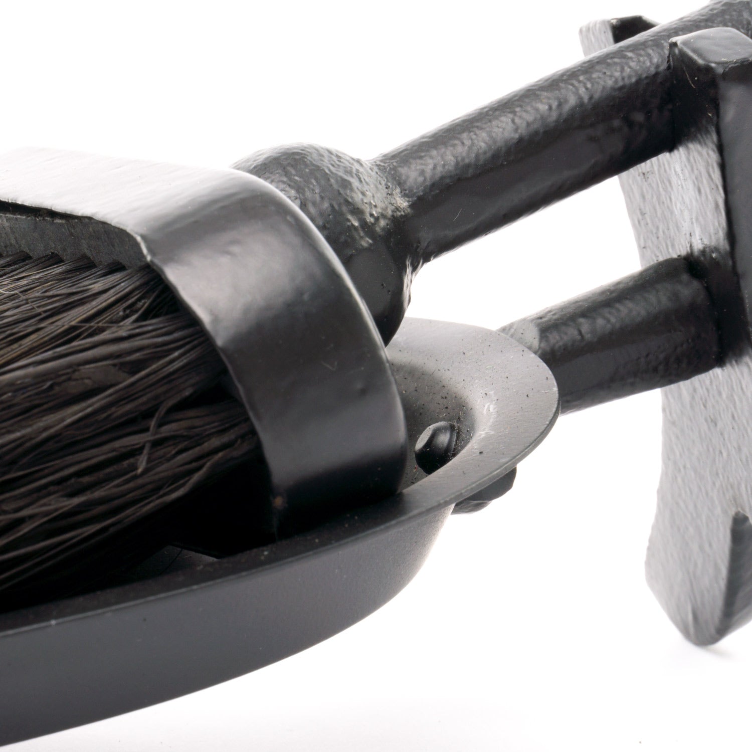 Black hearth tidy featuring a crook handle and sleek finish, combining elegance and functionality for any decor style.