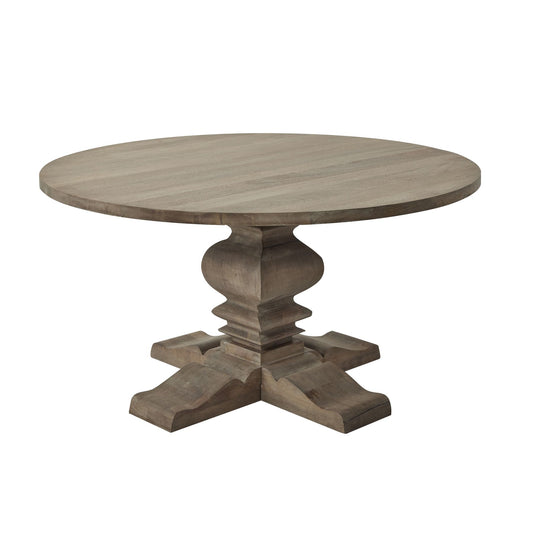Round pedestal dining table in a washed, bleached finish, featuring elegant ironwork handles and a sturdy, stylish base.
