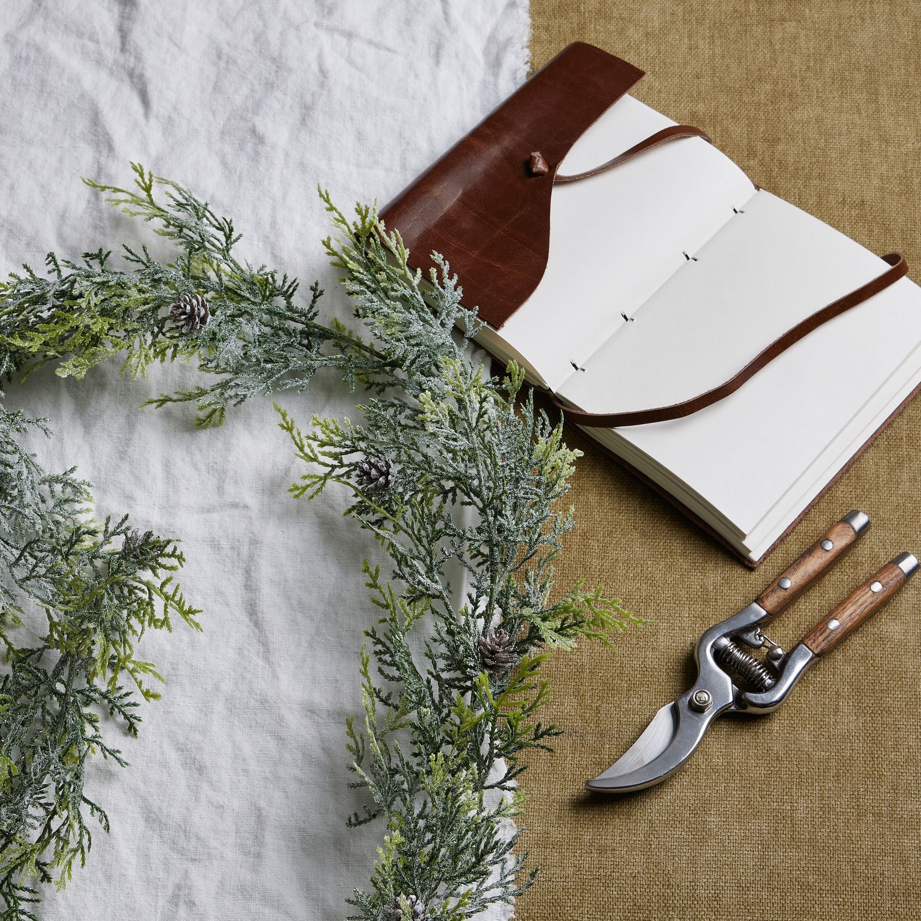 Frosted Pine Garland With Pinecones - Christmas Wreaths & Garlands from the Quanta Home collection.