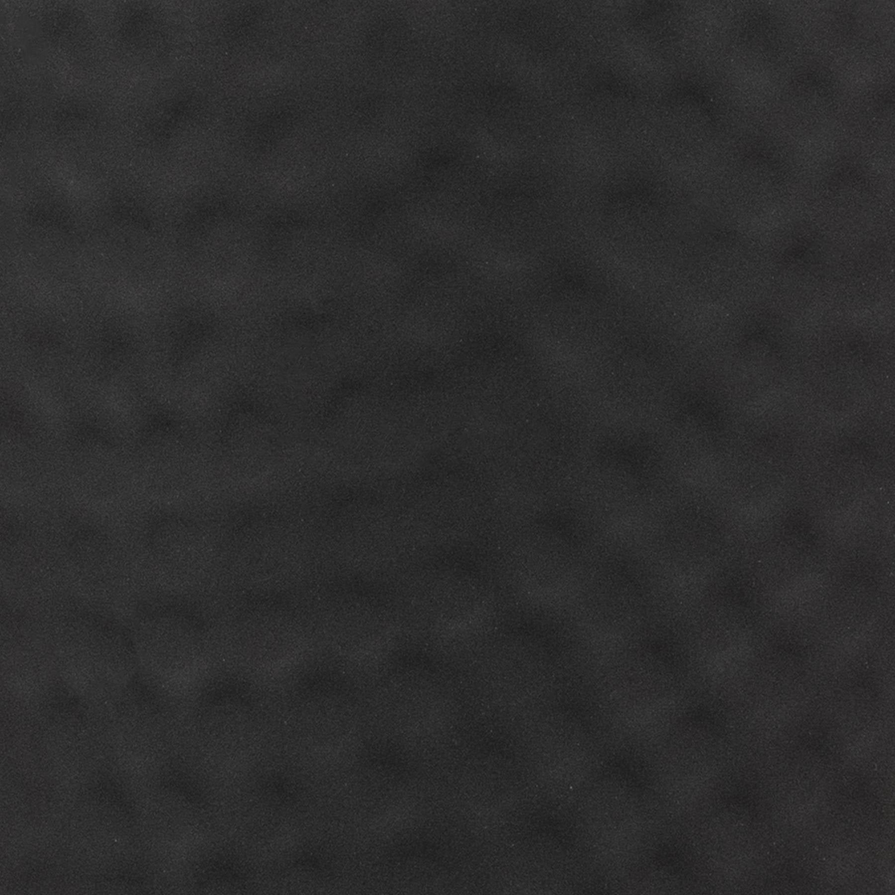 Matt black hammered vase with lid, featuring a distinctive textured surface that creates captivating light reflections.