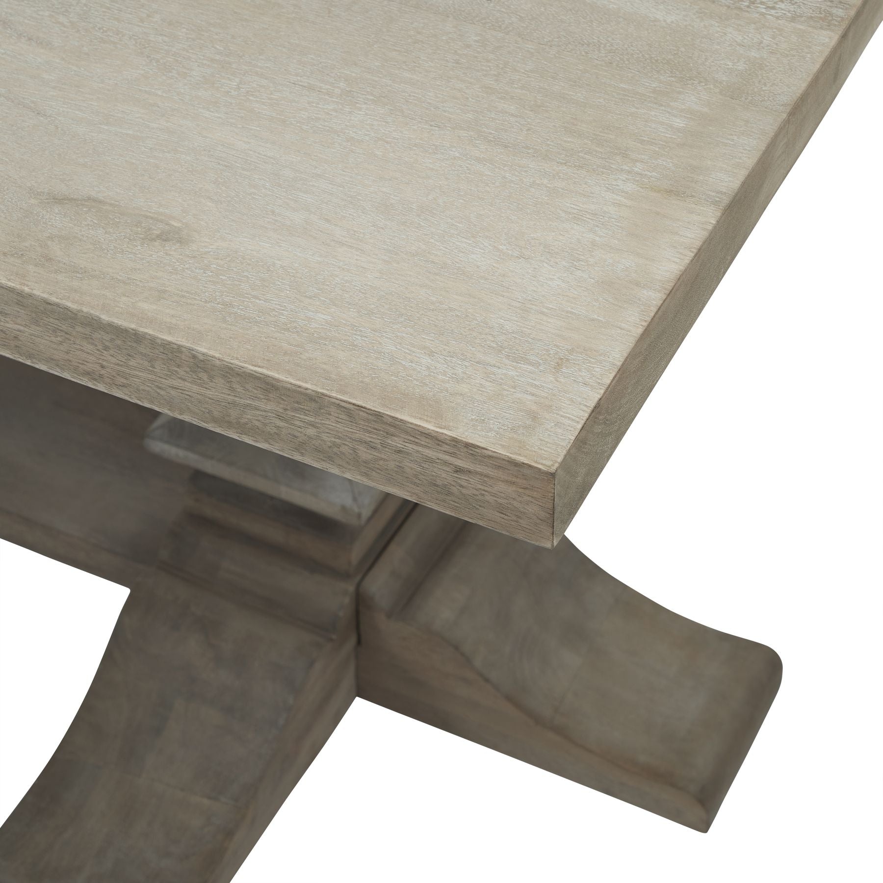 Large dining table with a washed, bleached hardwood top and industrial black iron accents, showcasing elegant French-inspired design.