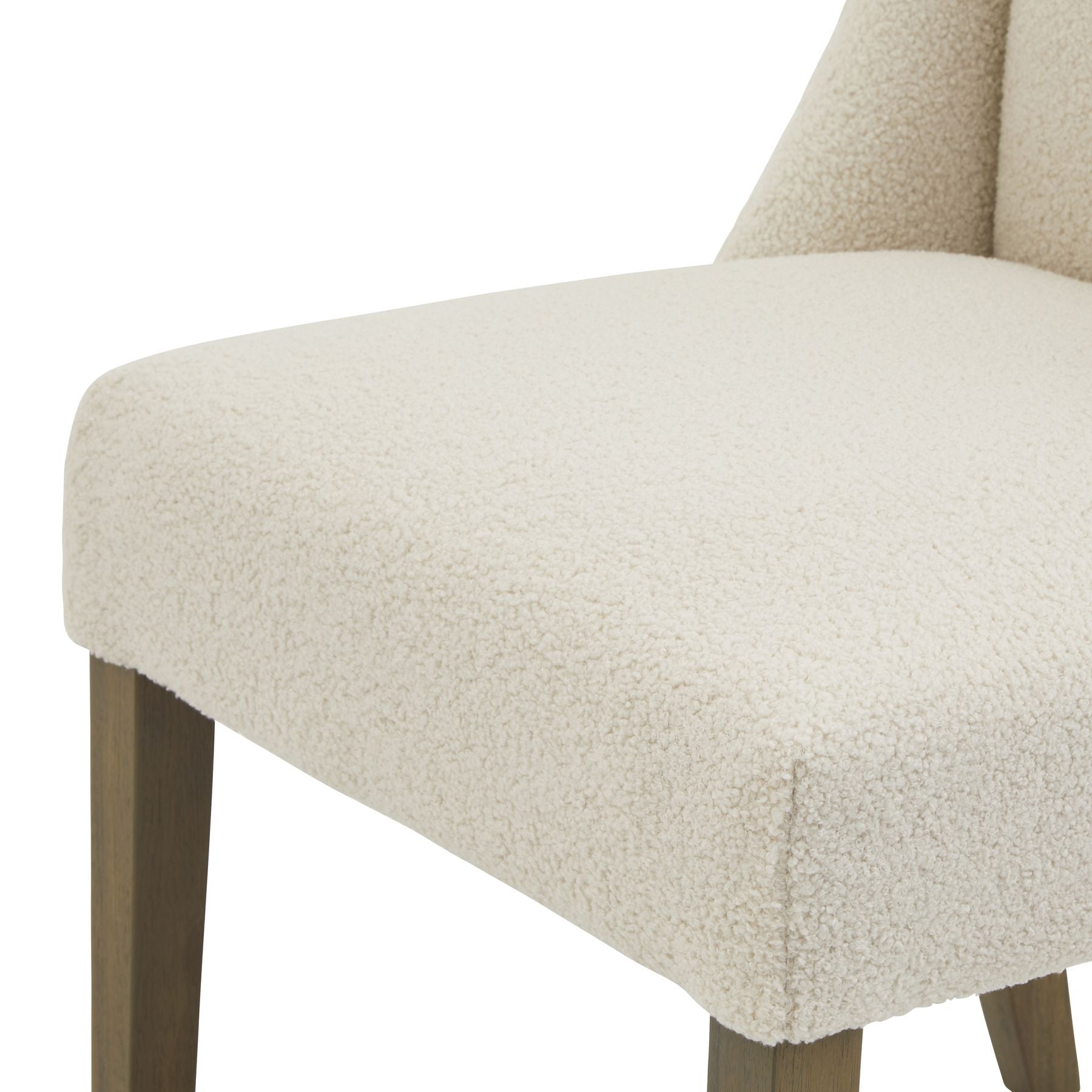 Cream boucle upholstery dining chair with a sleek rubberwood frame, combining elegance and modern design. Ideal for stylish dining spaces.