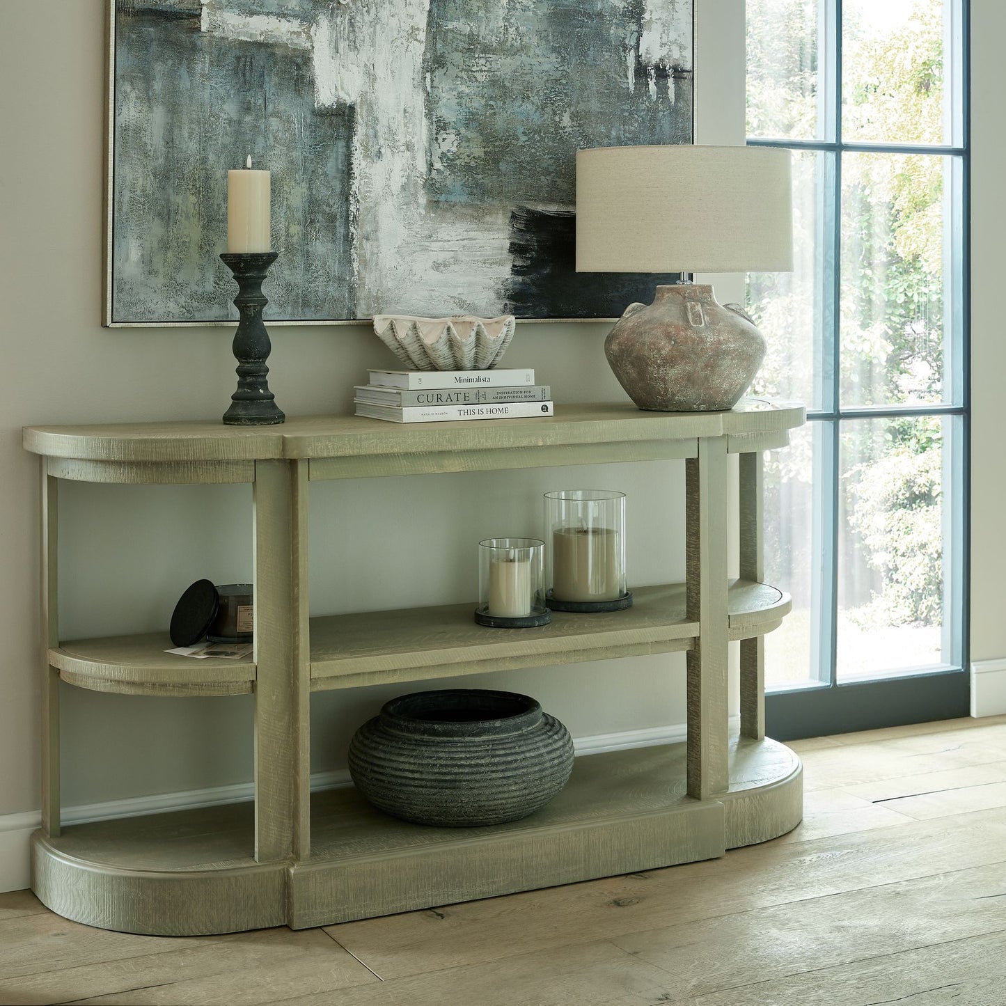 Taupe LED wax candle with a realistic dripping effect, set on a light wood table, enhancing a cozy, sophisticated ambiance.