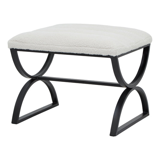 Luxurious cream ribbed upholstery atop a sleek black metal frame, perfect as an ottoman or accent piece for modern interiors.