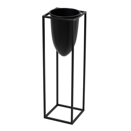 Sleek matte black bullet planter housed in a minimalist black frame, adding modern elegance to any interior space.
