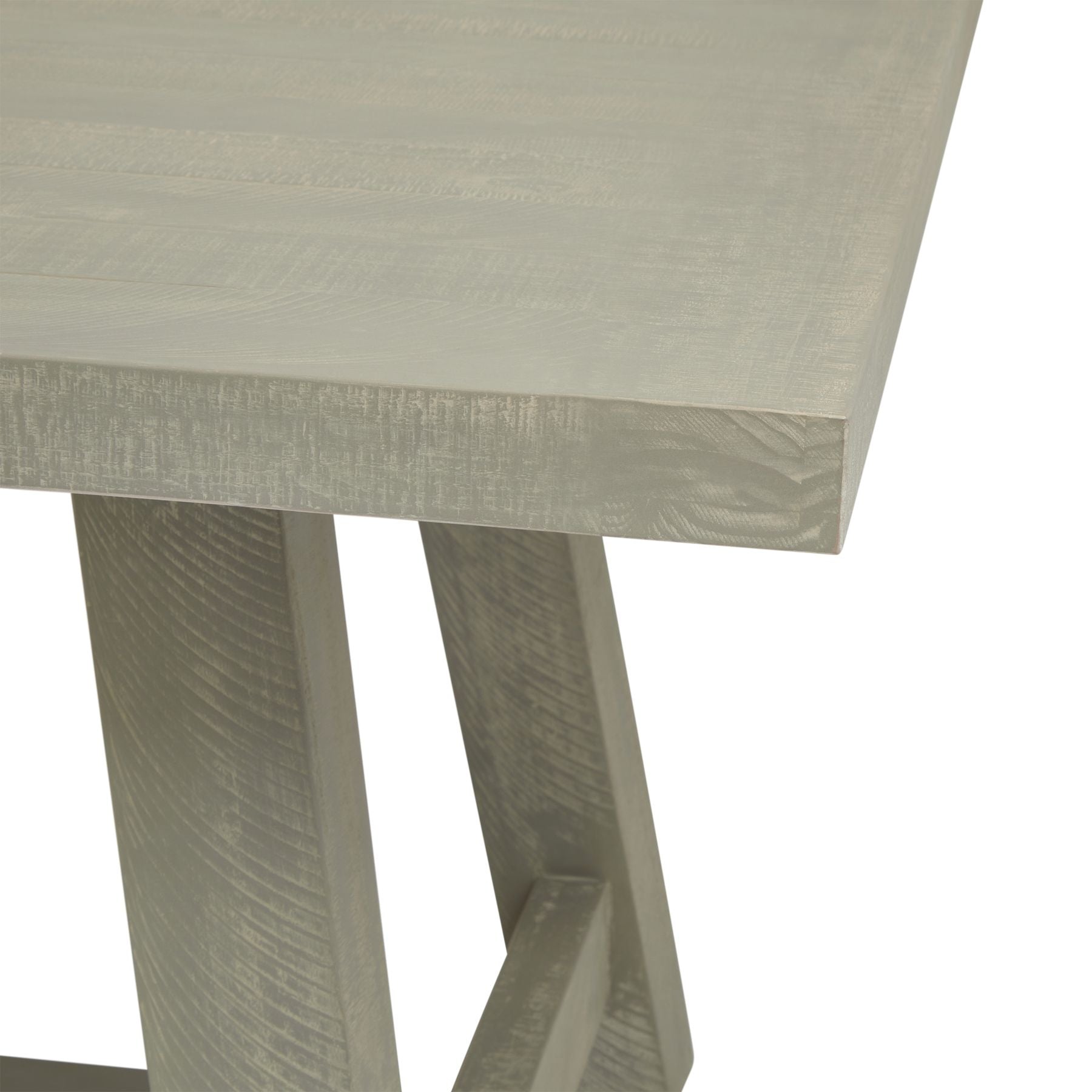 Rectangular dining table with a weathered finish, featuring soft curves and sleek lines for modern elegance.