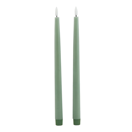 Sage LED wax dinner candles in a sleek tapered design, emitting a warm glow, ideal for elegant dining and décor.