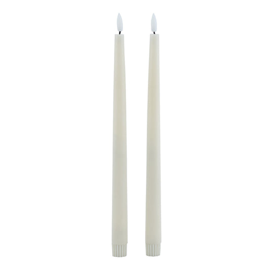 Two taupe LED wax dinner candles with a realistic melt effect and flickering flame illusion, perfect for elegant décor.