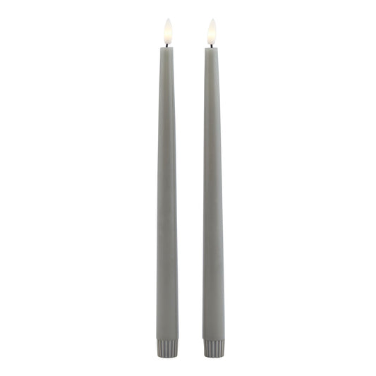 Two elegant, tall grey LED wax dinner candles with a realistic flicker effect, perfect for creating a cozy, sophisticated ambiance.