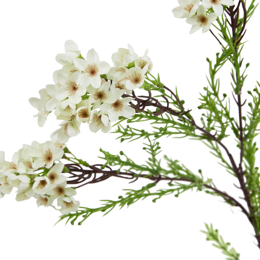 Lifelike white waxflower stem featuring delicate star-shaped blooms and greenery, perfect for elegant home decor.