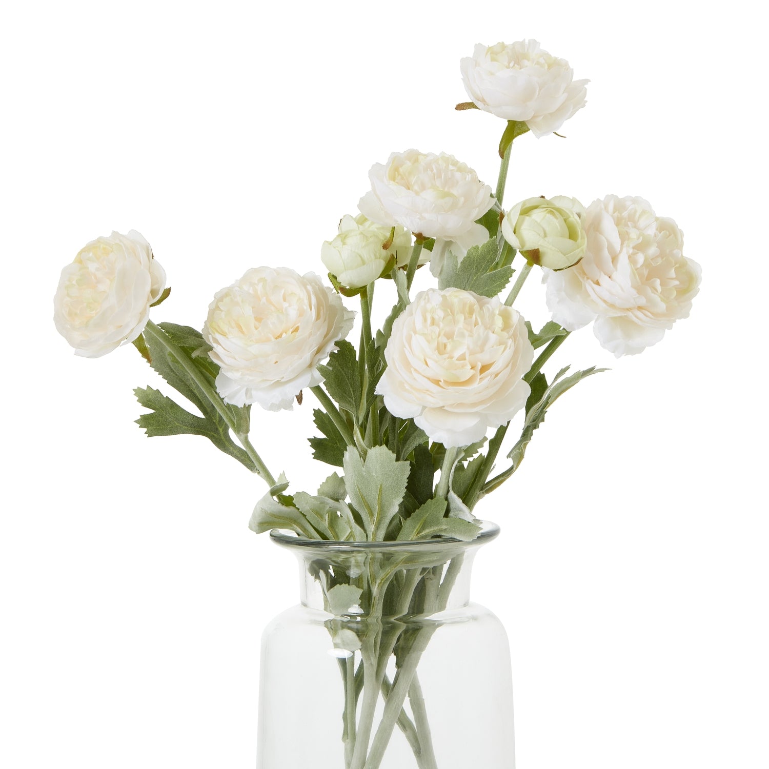Lifelike apricot ranunculus with layered cream petals and green foliage in a clear vase, adding elegant charm to any decor.