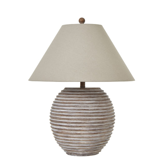Ceramic table lamp with a ribbed beige base and a soft linen shade, creating a warm, inviting ambiance for modern interiors.