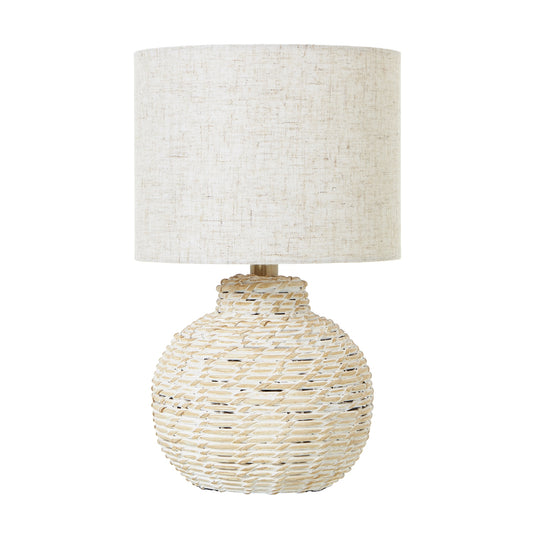 Bulbous white wicker table lamp with a beige linen shade, exuding rustic charm and warmth for any stylish decor.