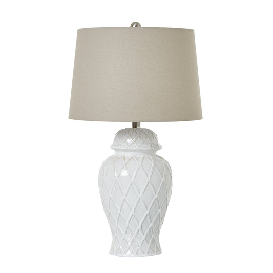 Elegant white ceramic ginger jar lamp with a textured diamond pattern, topped with a neutral linen shade.