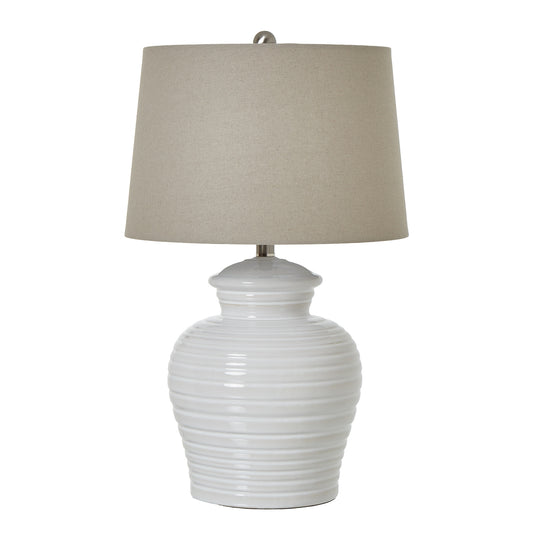 Elegant white ceramic pot lamp with horizontal ribbing and a neutral linen shade, perfect for any decor.