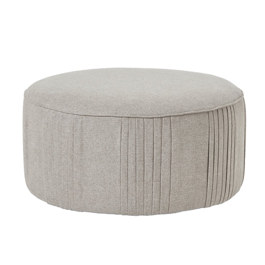 Round, soft oatmeal twill ottoman with subtle pleating, designed for comfortable seating and seamless 360-degree swivel functionality.