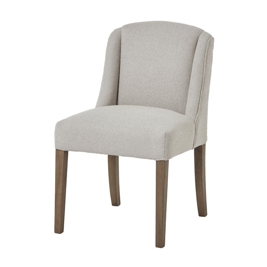 Plush, neutral-toned twill upholstery dining chair with curved backrest, sloped armrests, and sturdy wooden frame in a rustic finish.