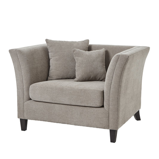 Luxurious taupe snuggle chair with plush padding, two decorative cushions, and elegant curved arms, ideal for small spaces.