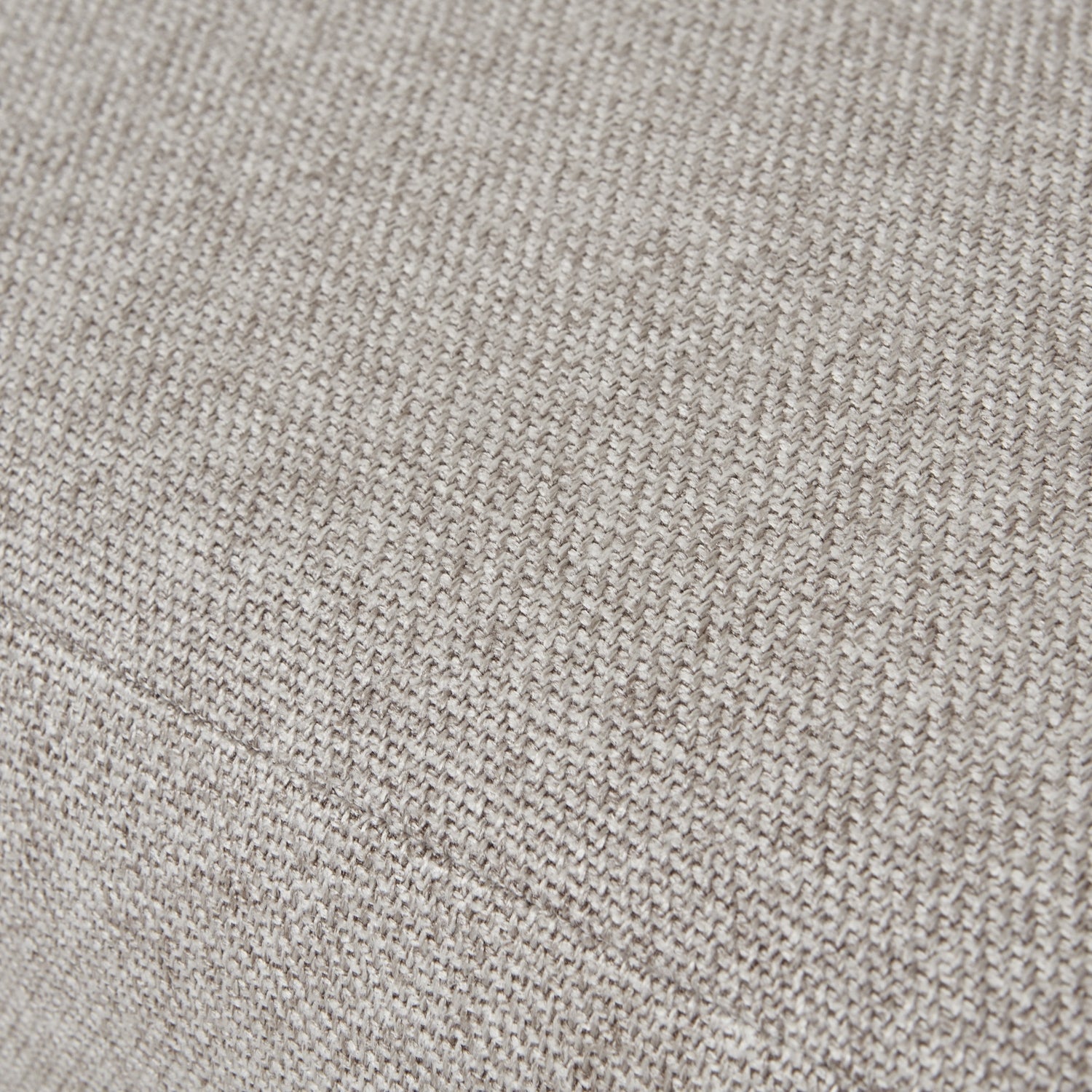 Plush oatmeal-twill upholstery with intricate tufting on a dining chair, featuring solid oak legs for durability and elegance.