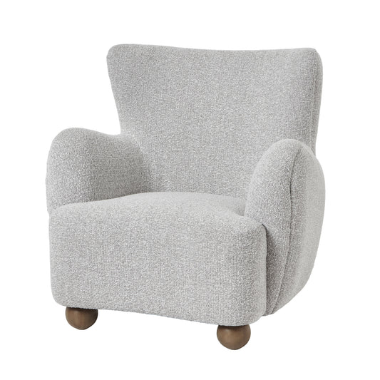 Greige plush armchair with a modern, curved design and soft upholstery, supported by rounded wooden legs.