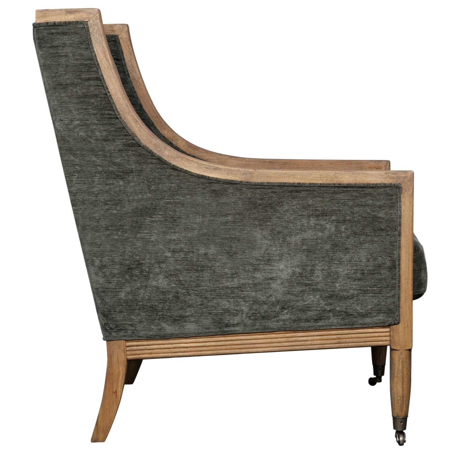 Olive velvet armchair with a curved silhouette and wooden legs, showcasing elegance and meticulous craftsmanship.