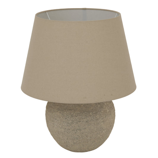 Tuscan Grey Lamp featuring a round ceramic base and a beige fabric shade, providing warm, ambient illumination for any room.