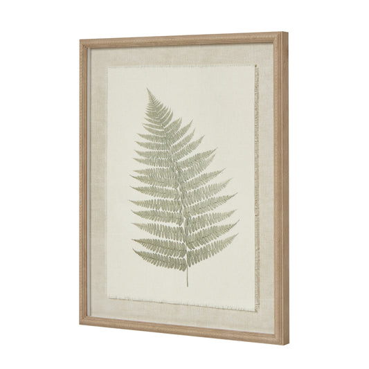 Framed artwork featuring a delicate green fern on textured torn paper, bordered by an elegant beaded frame.