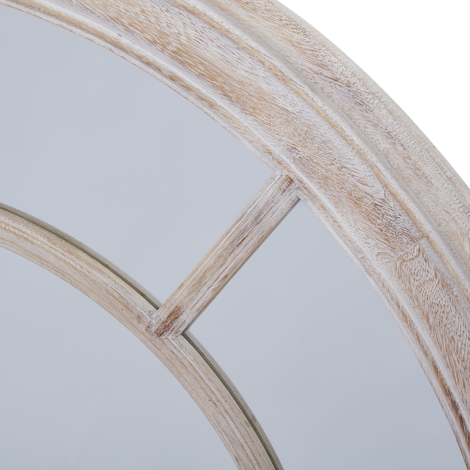 Round mirror with a weathered wood frame in soft, light tones, showcasing a rustic, elegant design and artisanal finishes.
