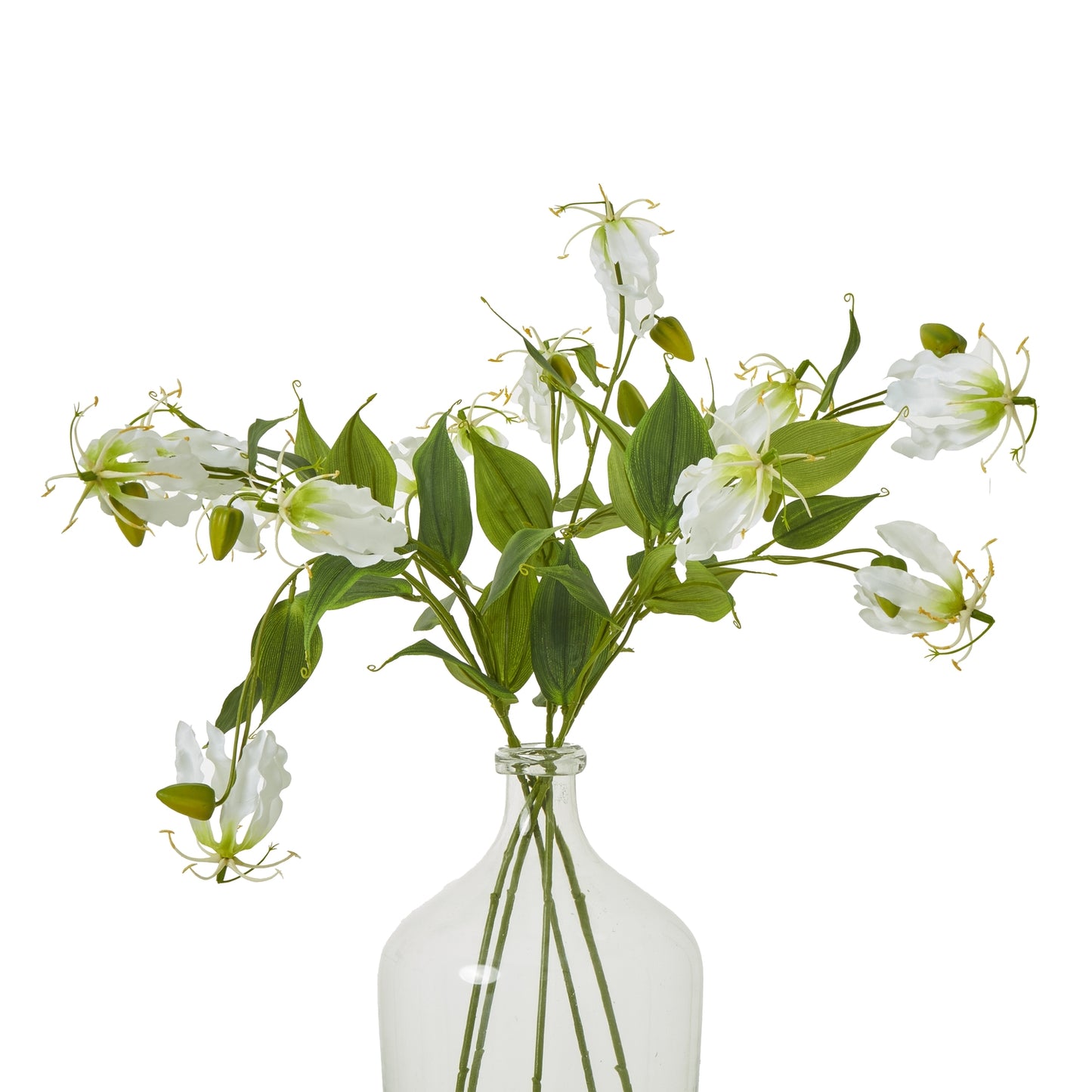 Cream Gloriosa spray featuring lifelike white petals and green leaves, elegantly arranged in a clear glass vase.