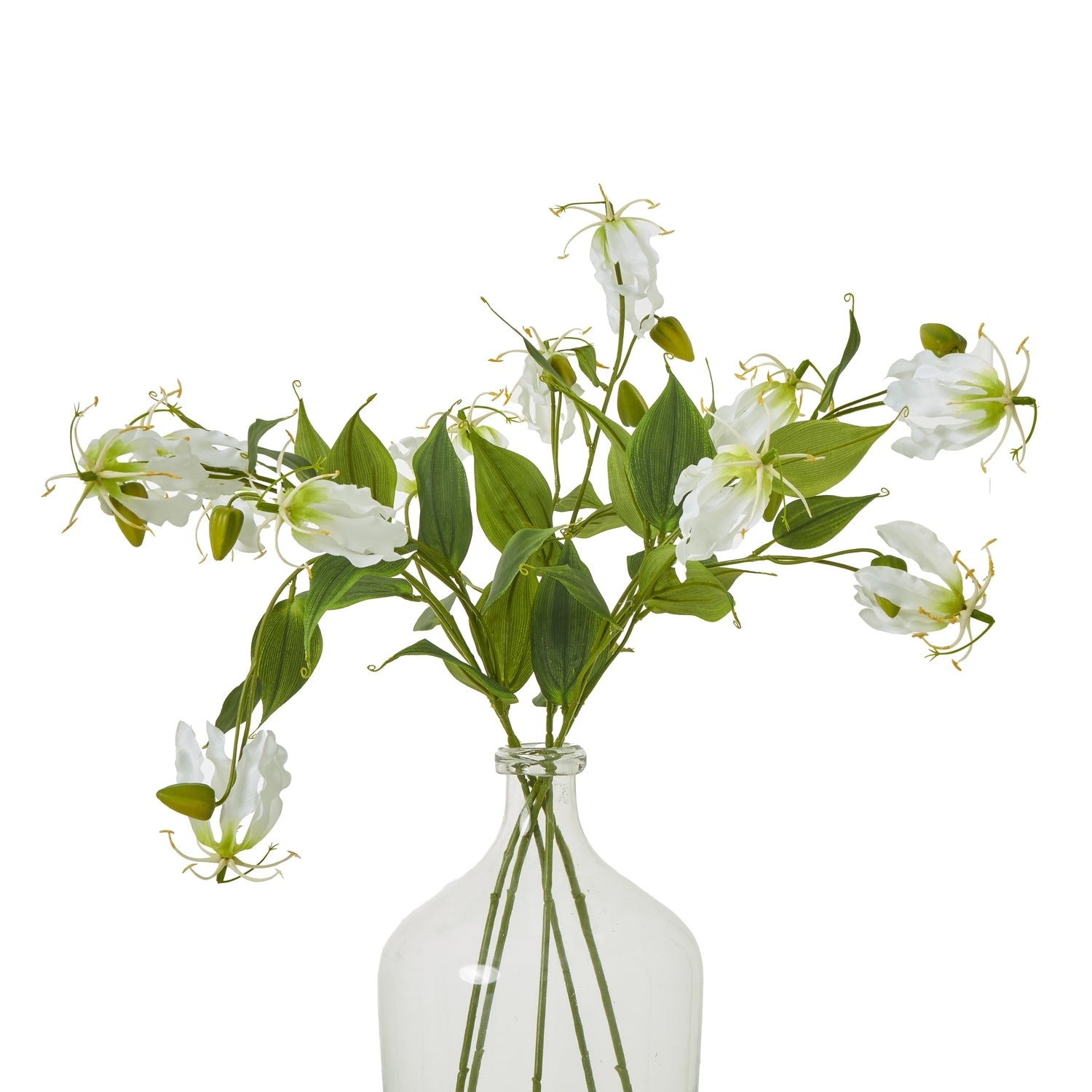 Cream Gloriosa spray featuring lifelike white petals and green leaves, elegantly arranged in a clear glass vase.