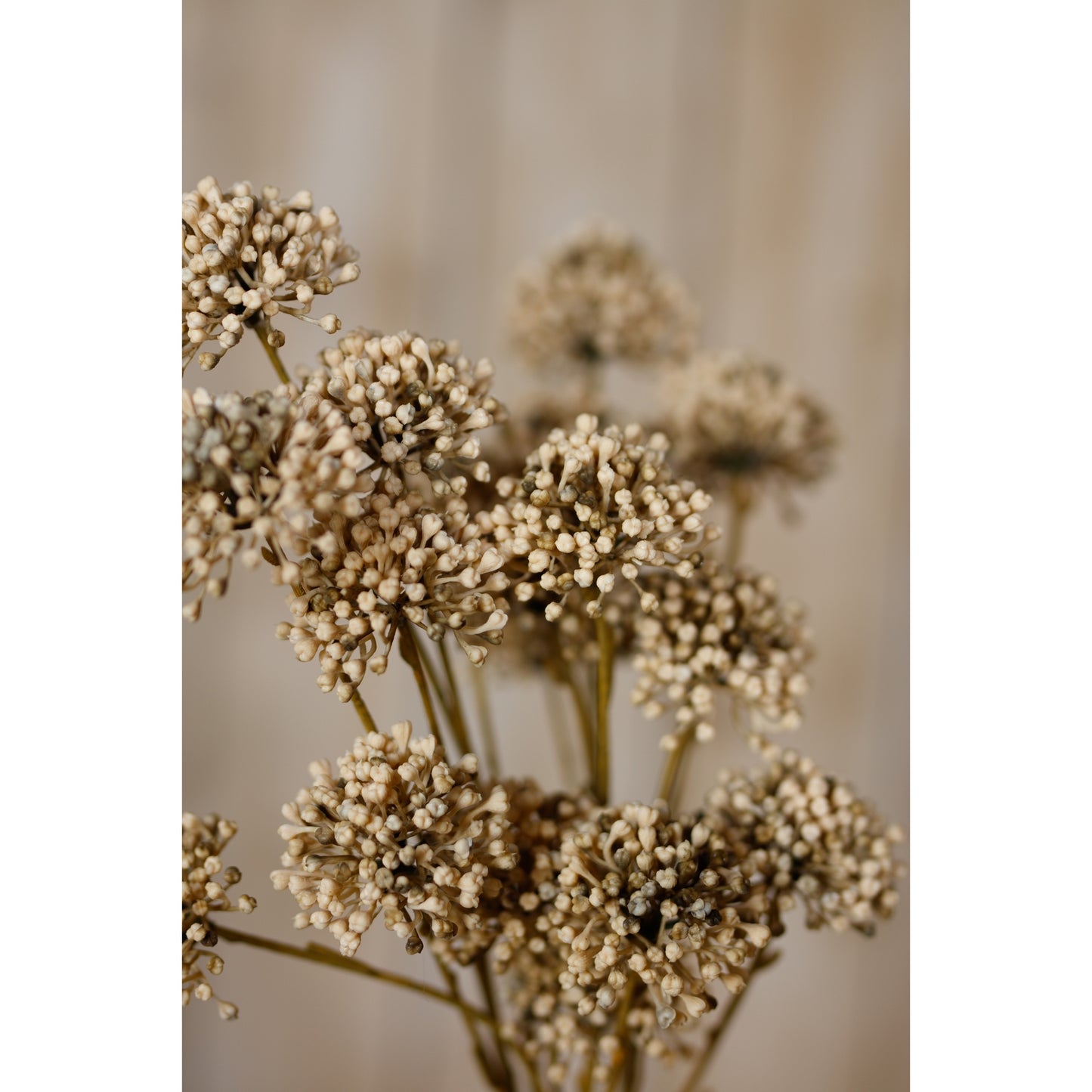 Artificial brown allium spray featuring intricately crafted spherical blooms, enhancing interiors with warm, earthy tones.