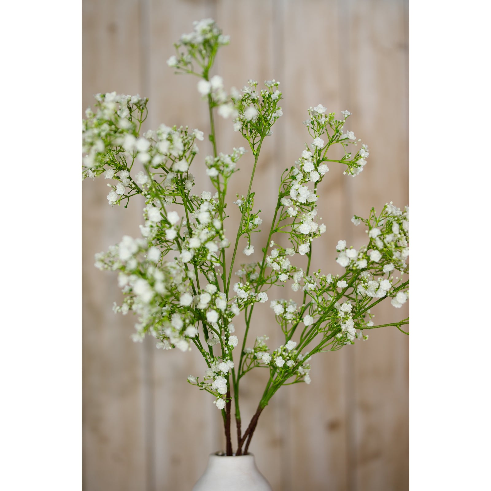 Cream Gypsophila Spray featuring delicate, white clusters on green stems, creating an ethereal touch in a minimalist vase.
