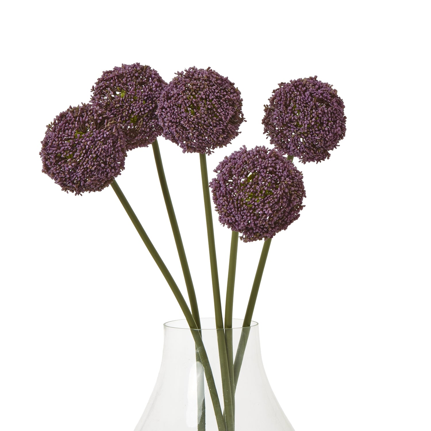 Purple allium stems with spherical blooms, set in a clear vase, showcasing elegant faux design and green stems.
