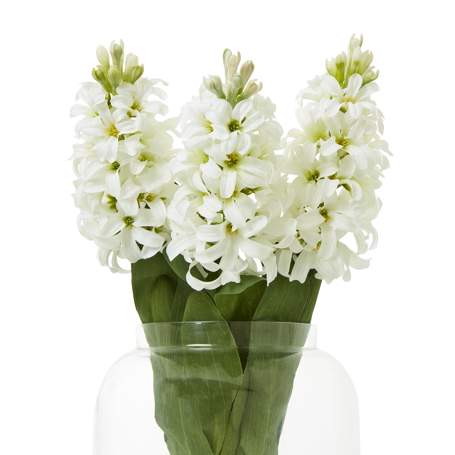 Artificial white hyacinth stem with delicate blooms and lush green leaves, displayed in a clear vase for elegant decor.
