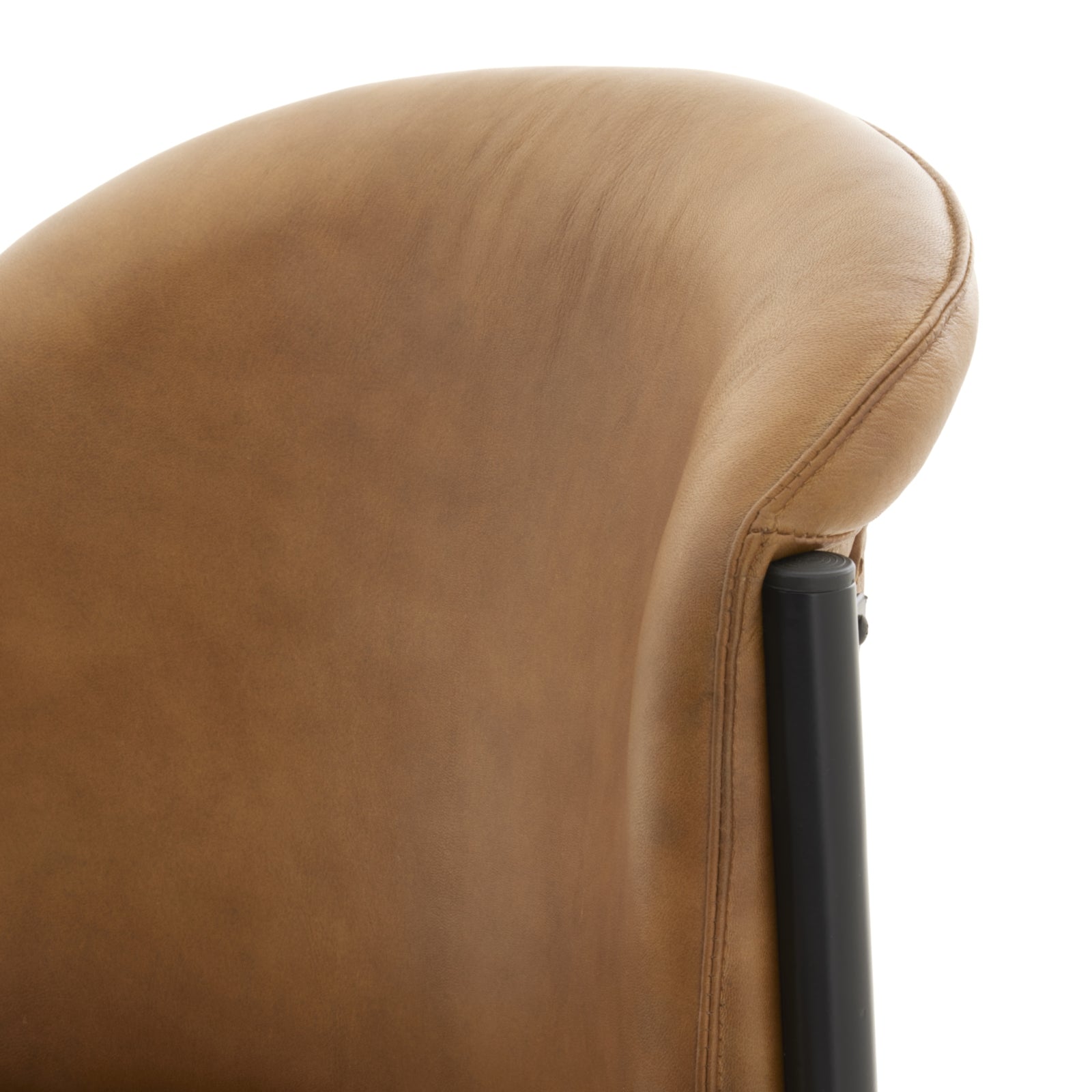 Curved dining chair in warm tan full-grain leather with a sleek black metal frame, blending elegance and comfort.