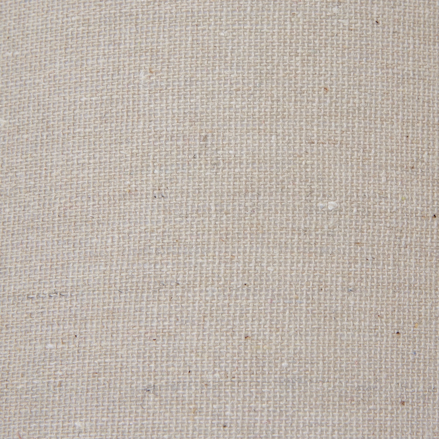 Linen shade in a neutral tone atop a distressed black base, combining rustic charm with versatile elegance for any decor style.