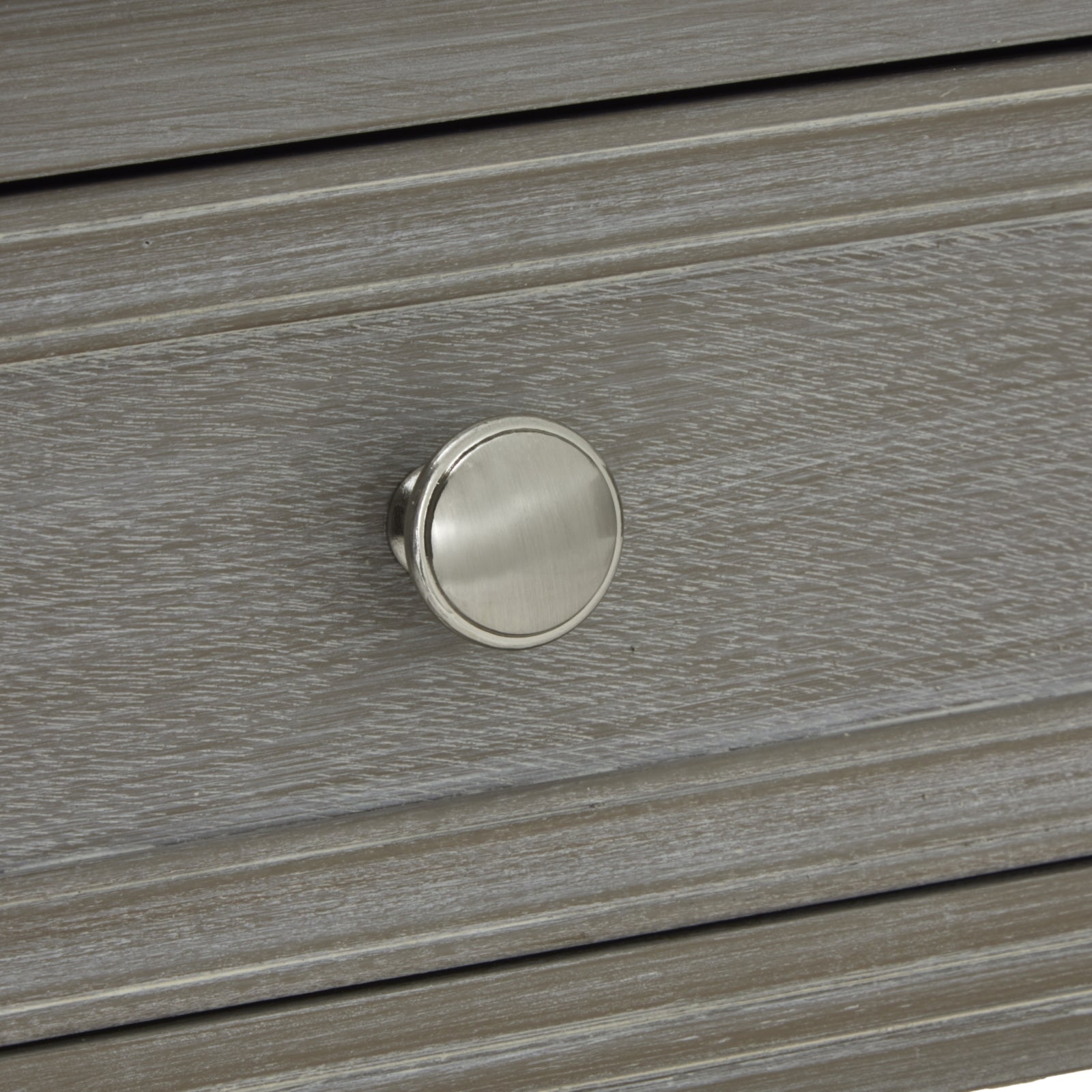 Close-up of a light gray console table drawer featuring a sleek, round, brushed nickel knob, showcasing refined craftsmanship.