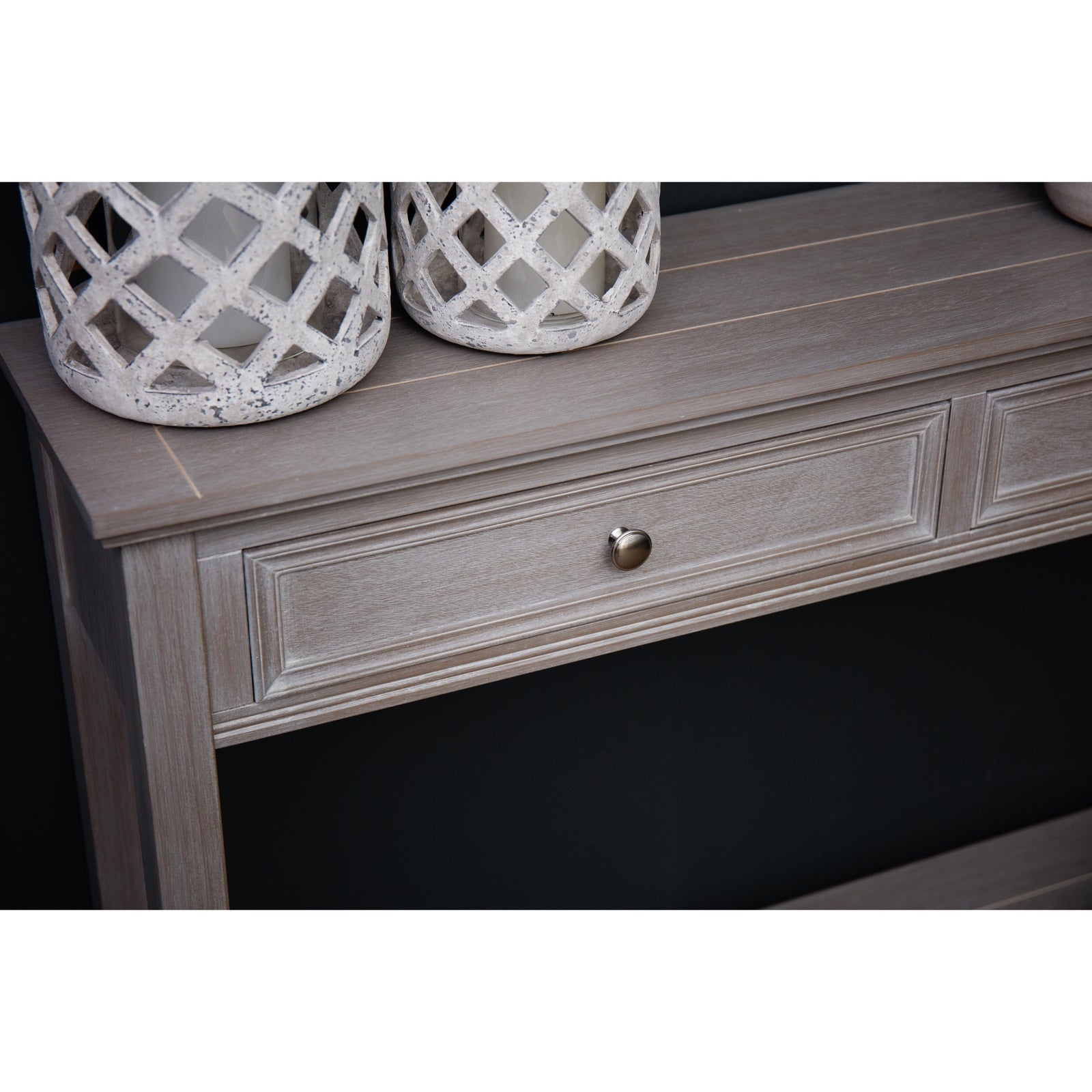 Light gray two-drawer console table with elegant detailing, featuring a brushed silver drawer knob, complemented by decorative vases.