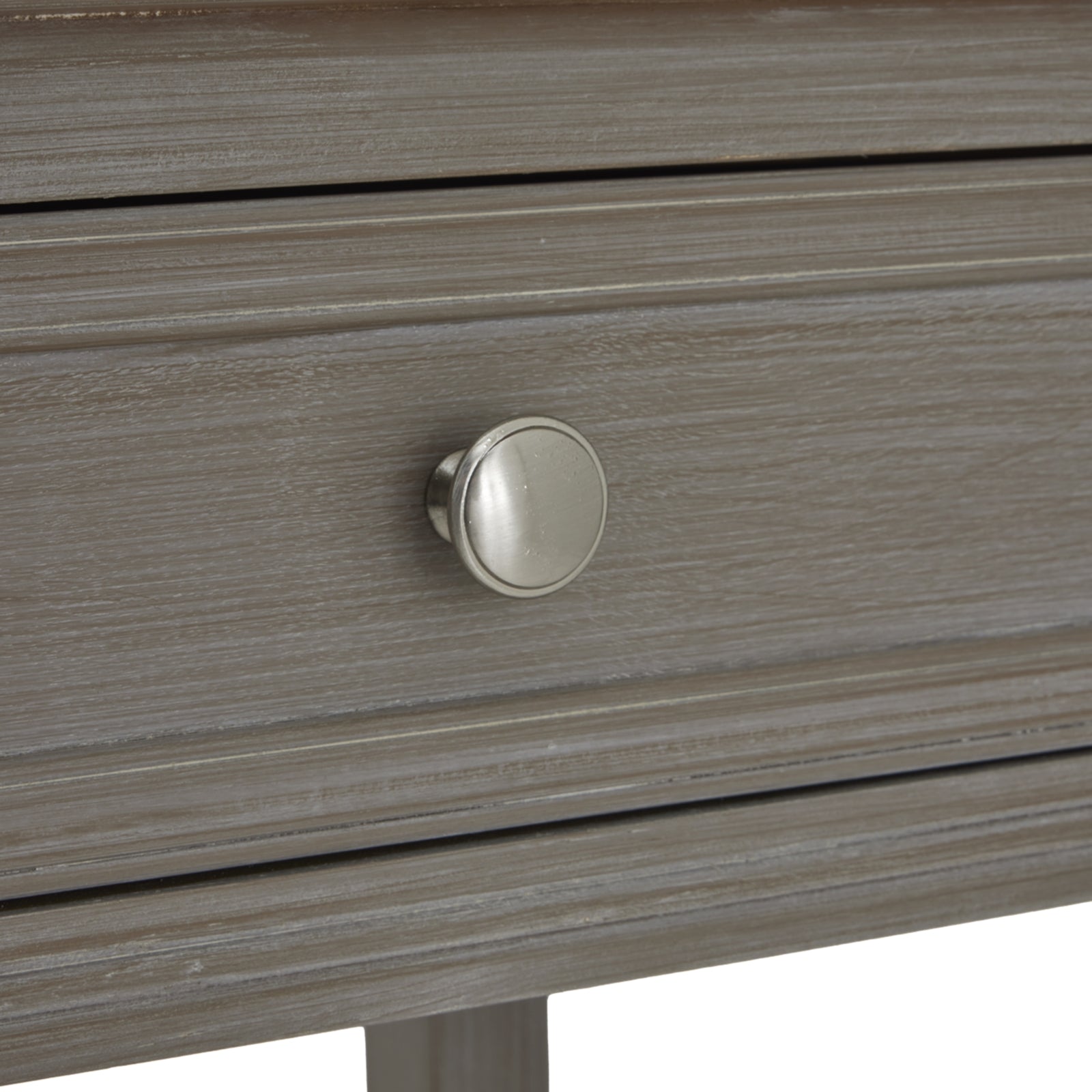 Distressed grey console table featuring four drawers with sleek metal knobs, exuding understated elegance and ample storage.