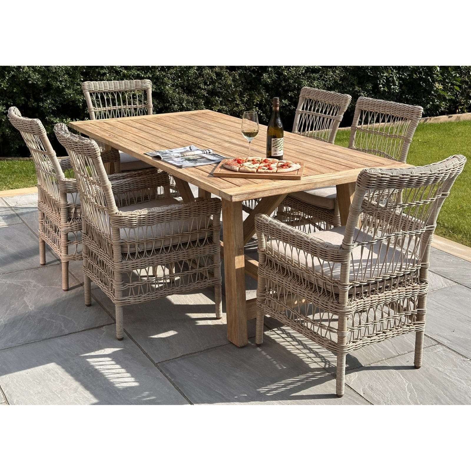Provence Collection outdoor dining chairs feature a chunky woven HDPE rattan design in neutral tones, with plush, removable cushions.