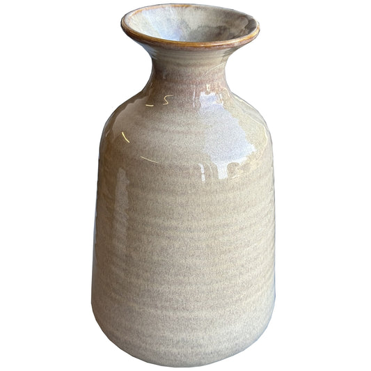 Tall ridged vase in soft beige with organic ripple texture, showcasing a modern cylindrical shape ideal for floral arrangements.