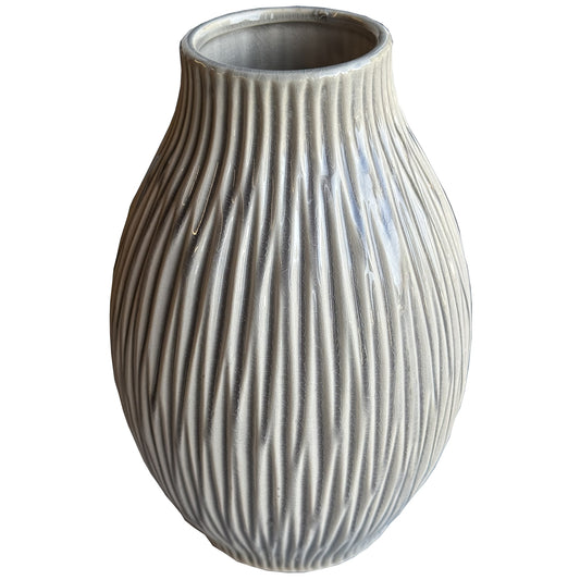 Large bulbous vase with a flecked, textured surface in soft red, combining modern elegance with a classic silhouette.