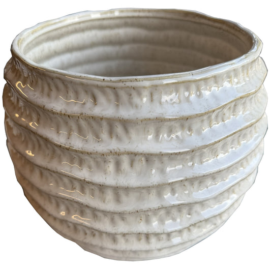 White ridged pot vase featuring pronounced vertical lines, creating dynamic shadows and a sophisticated, balanced silhouette.