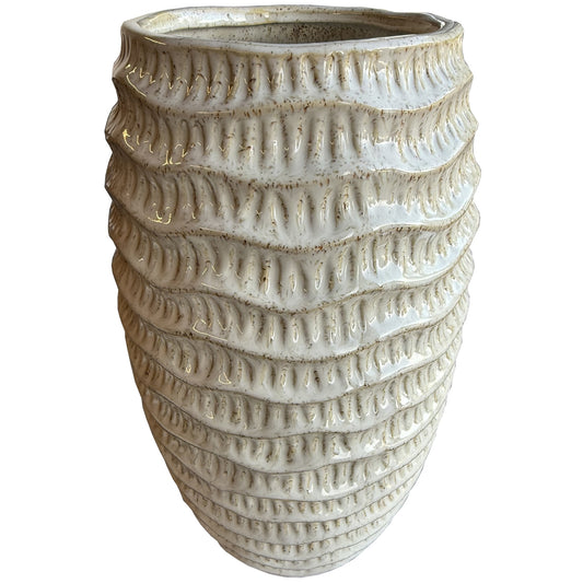 White ceramic vase with vertical ridges, offering a modern shape and textured surface, enhancing sophisticated decor.