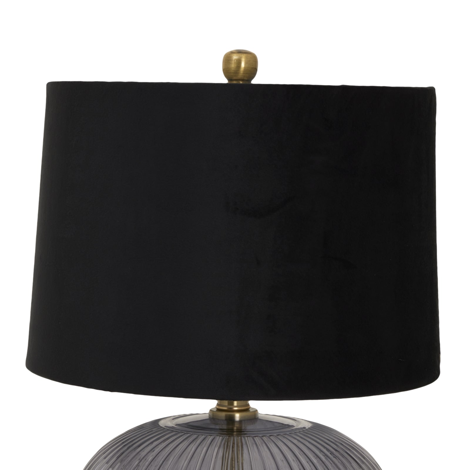 Ribbed glass lamp base with a black velvet shade and a gold finial, offering a modern, elegant touch to any space.